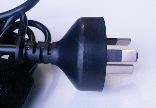 A photograph of a power plug's insulated pins; the part of the power cord that plugs into the wall.