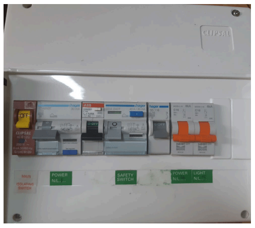 A photograph of a switchboard with incorrect labels for the switches.